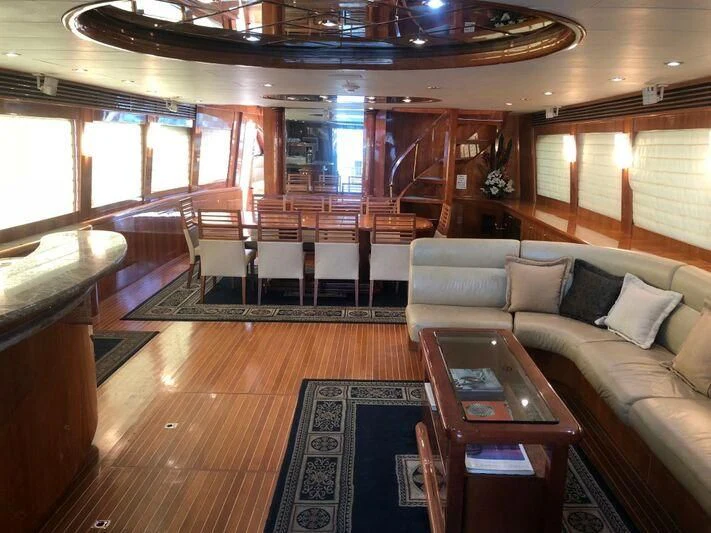 a living room with a wood floor aboard SALT II Yacht for Sale