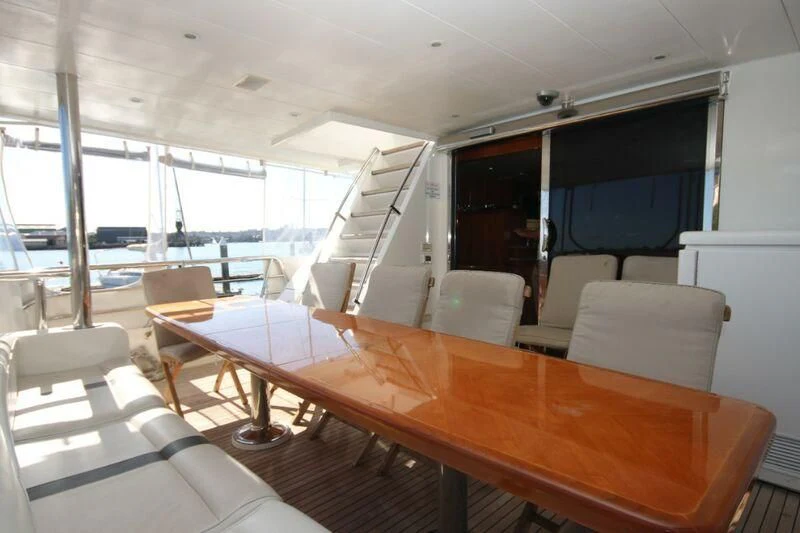 a room with a table and chairs aboard SALT II Yacht for Sale