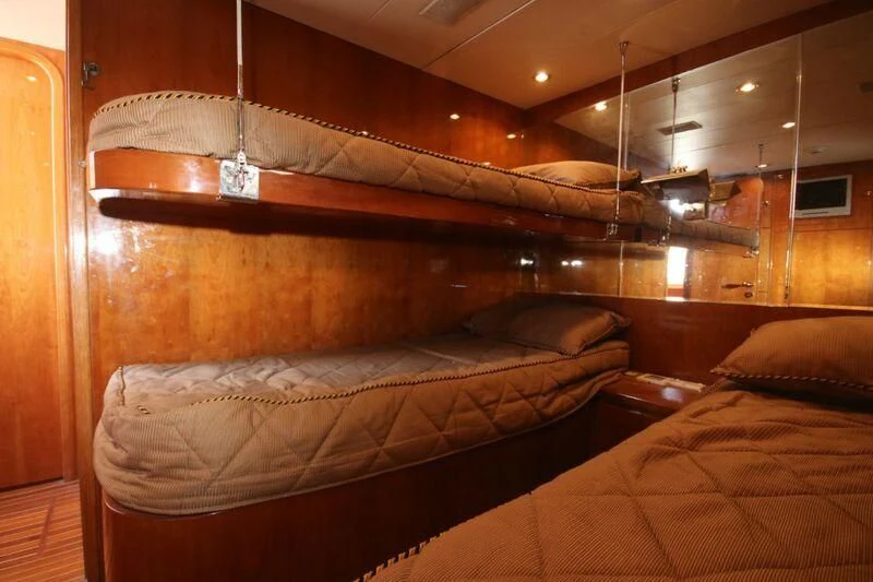 a couple of beds in a room aboard SALT II Yacht for Sale