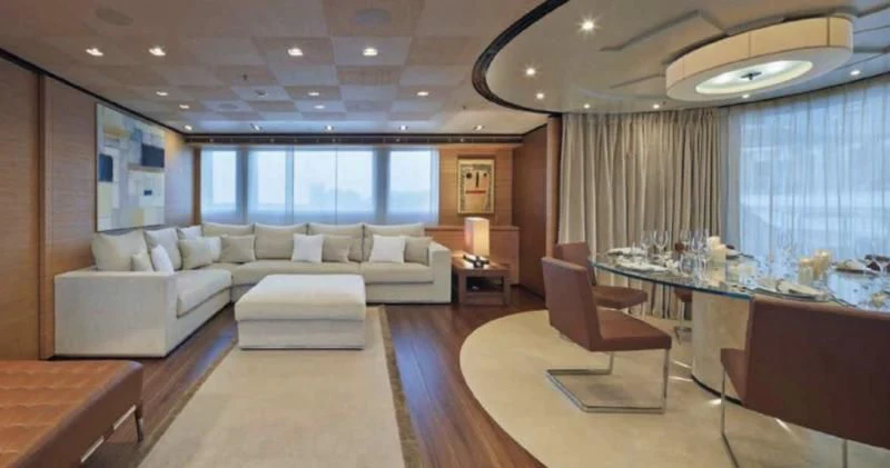 a large living room with a large table and chairs aboard APRIES W Yacht for Sale