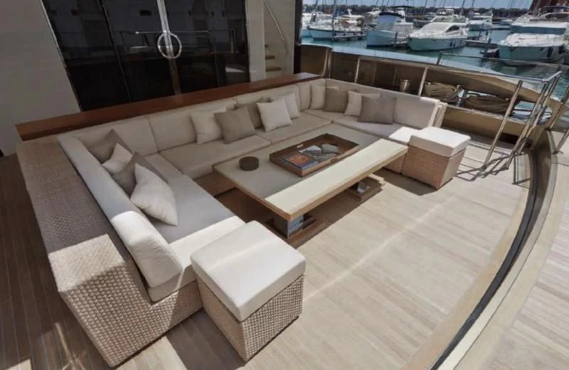 a living room with a couch and a table aboard APRIES W Yacht for Sale