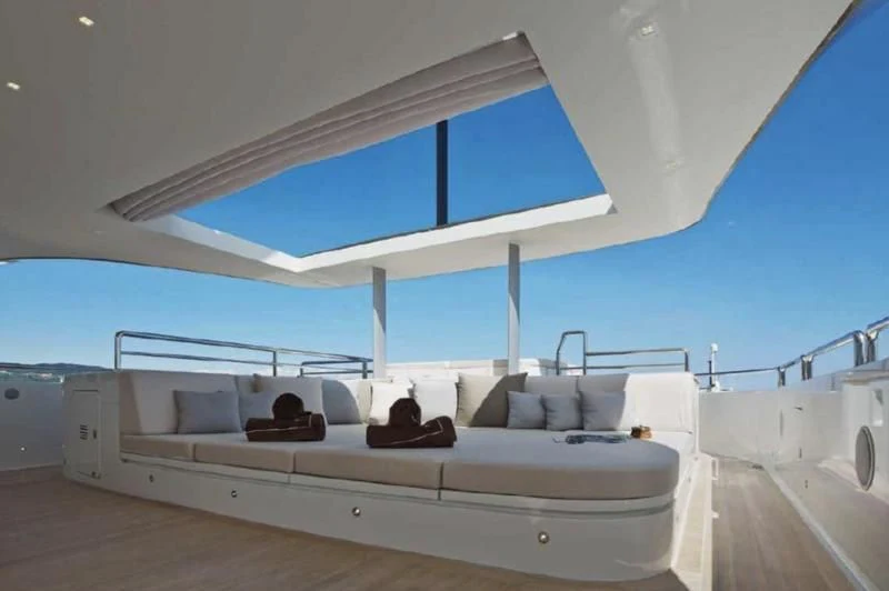 a large white room with a bed aboard APRIES W Yacht for Sale