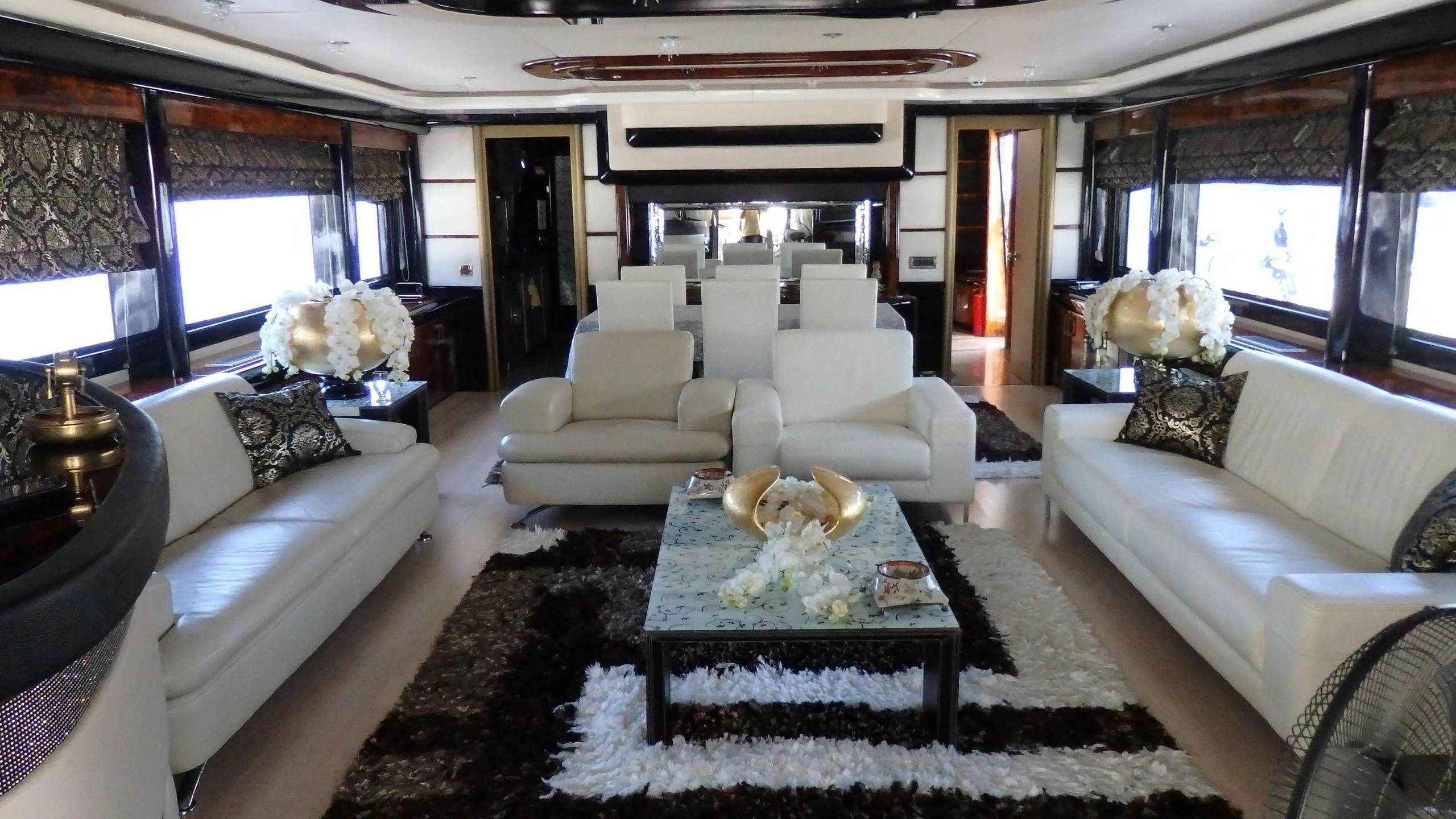 a living room with a couch and a coffee table aboard APRIES W Yacht for Sale