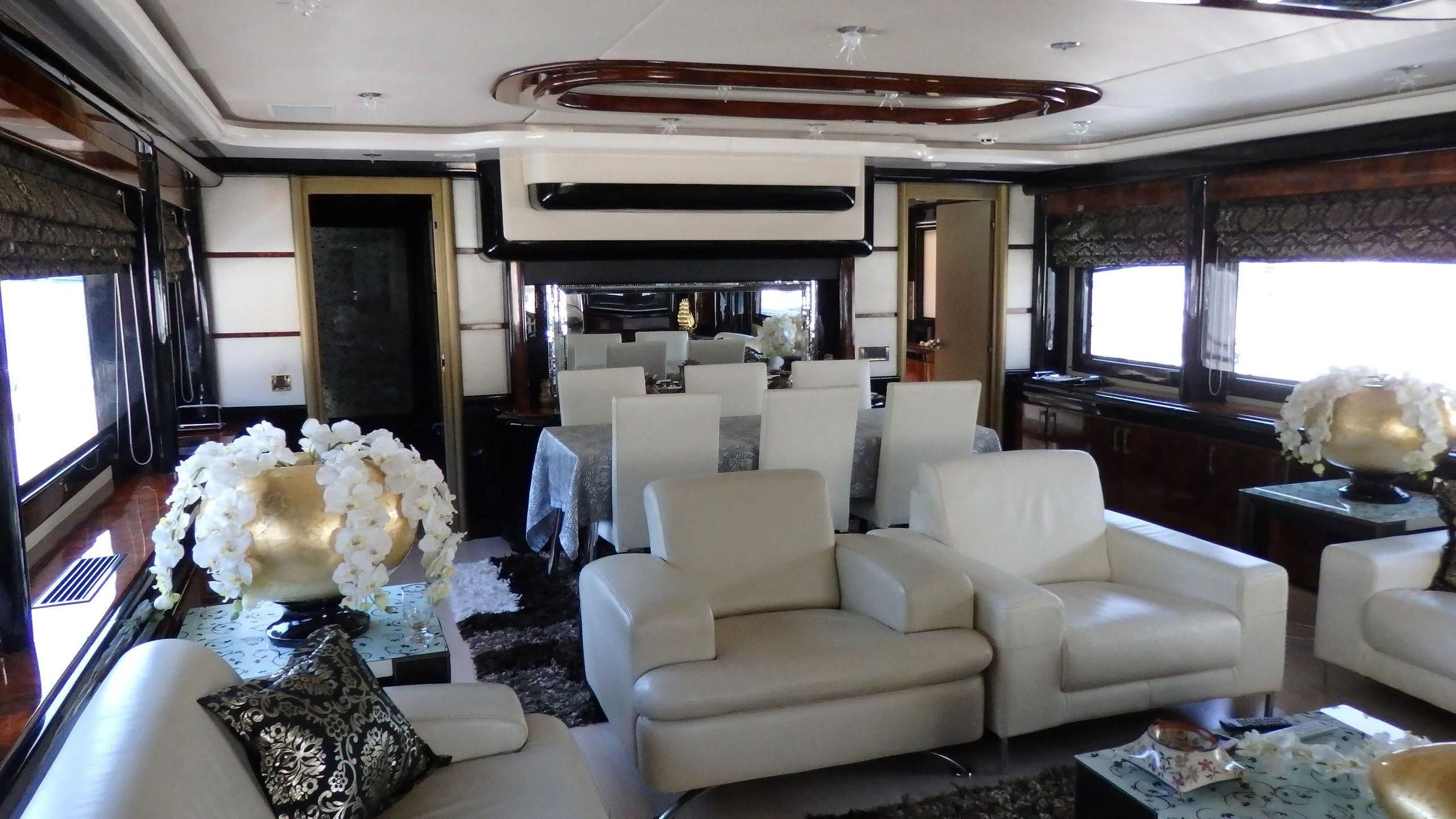a living room with white furniture aboard APRIES W Yacht for Sale