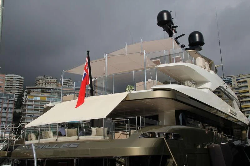 a boat with a flag on the front aboard APRIES W Yacht for Sale
