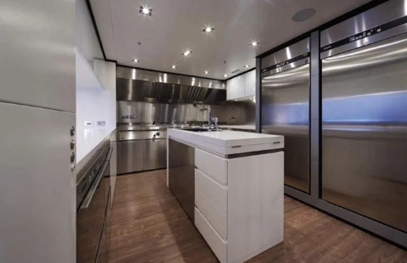 a kitchen with a large island aboard APRIES W Yacht for Sale