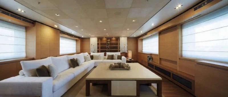 a room with a couch and a table aboard APRIES W Yacht for Sale