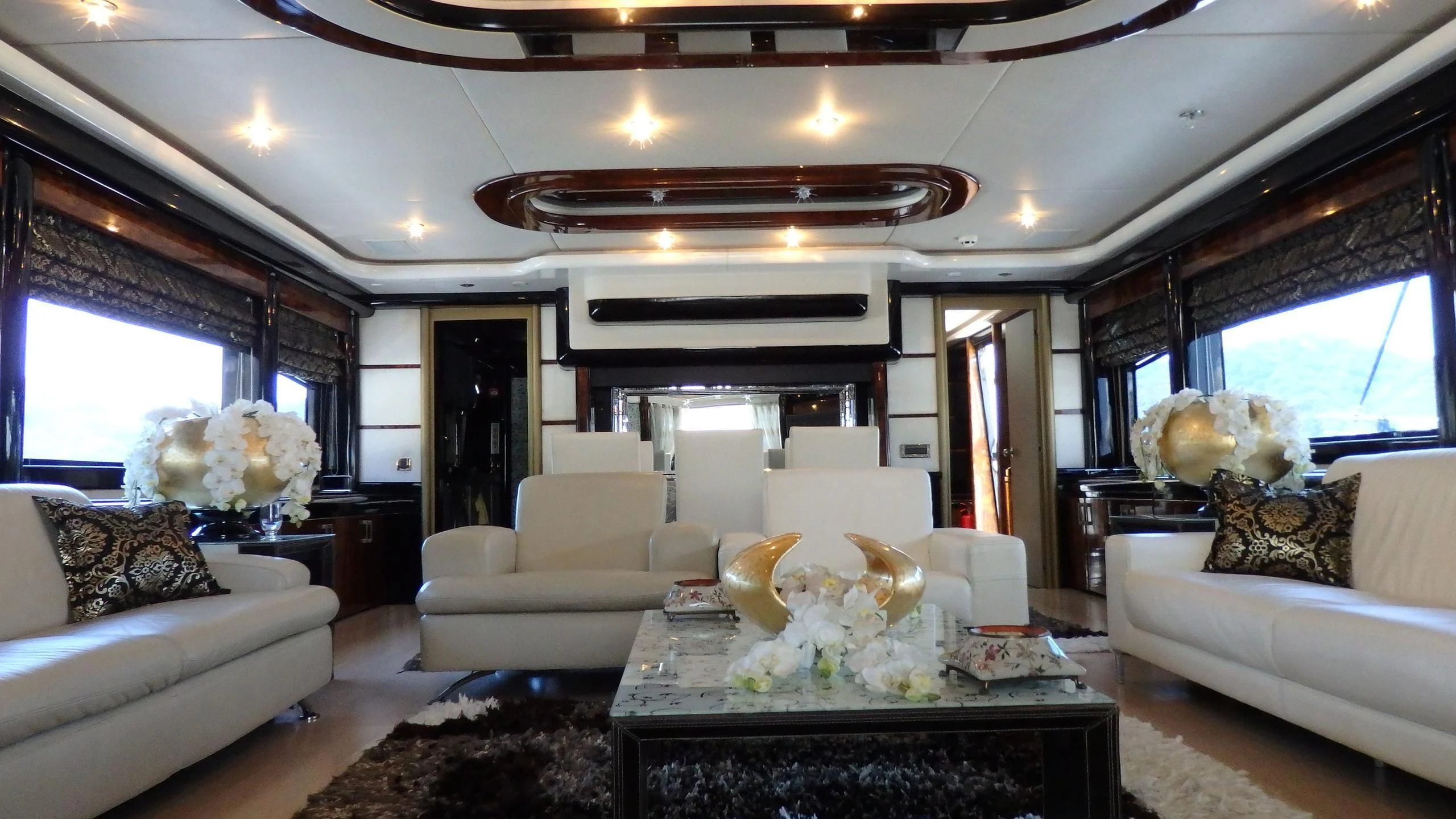 a living room with a large fireplace aboard APRIES W Yacht for Sale