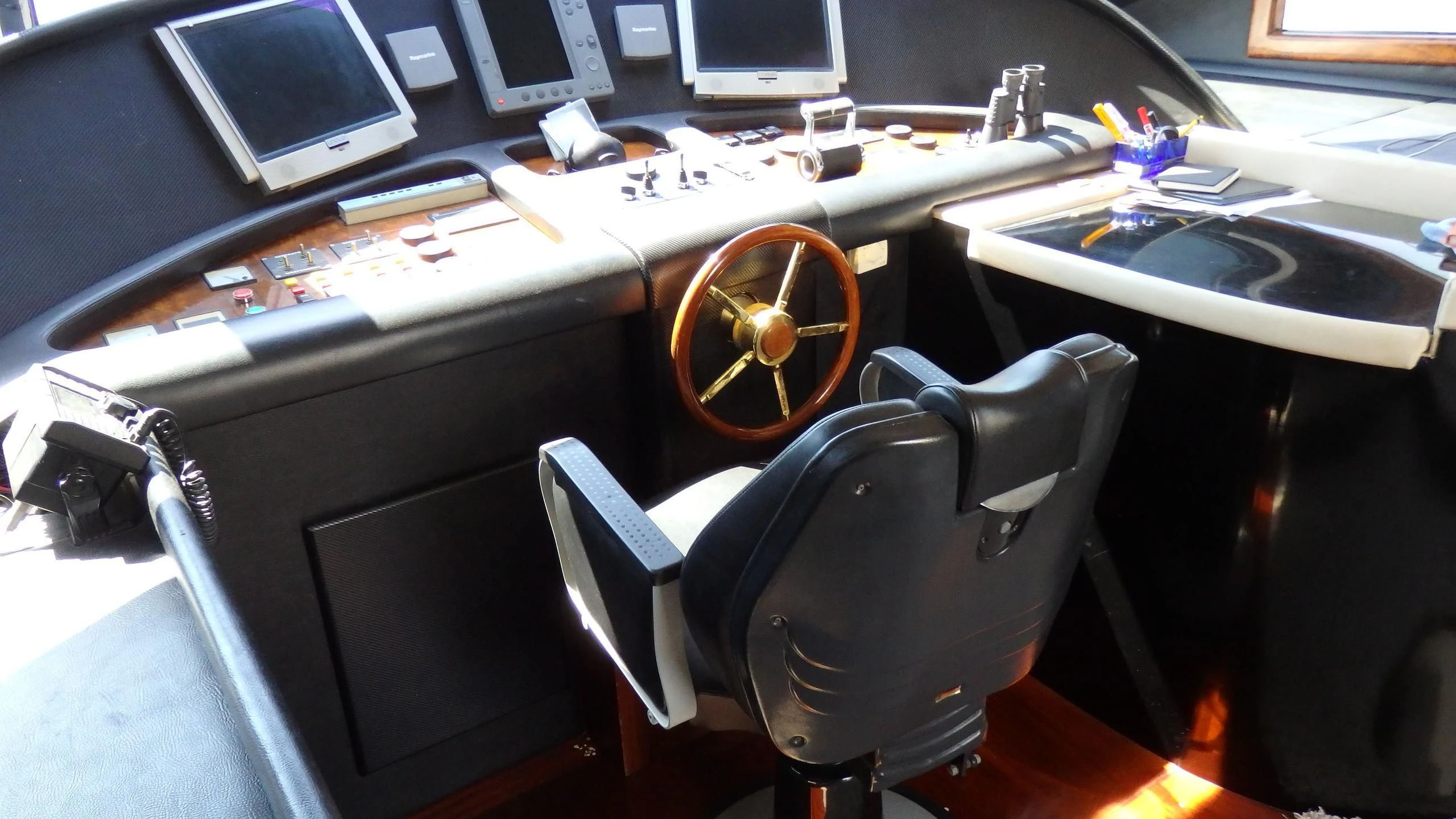 a black chair in a room aboard APRIES W Yacht for Sale