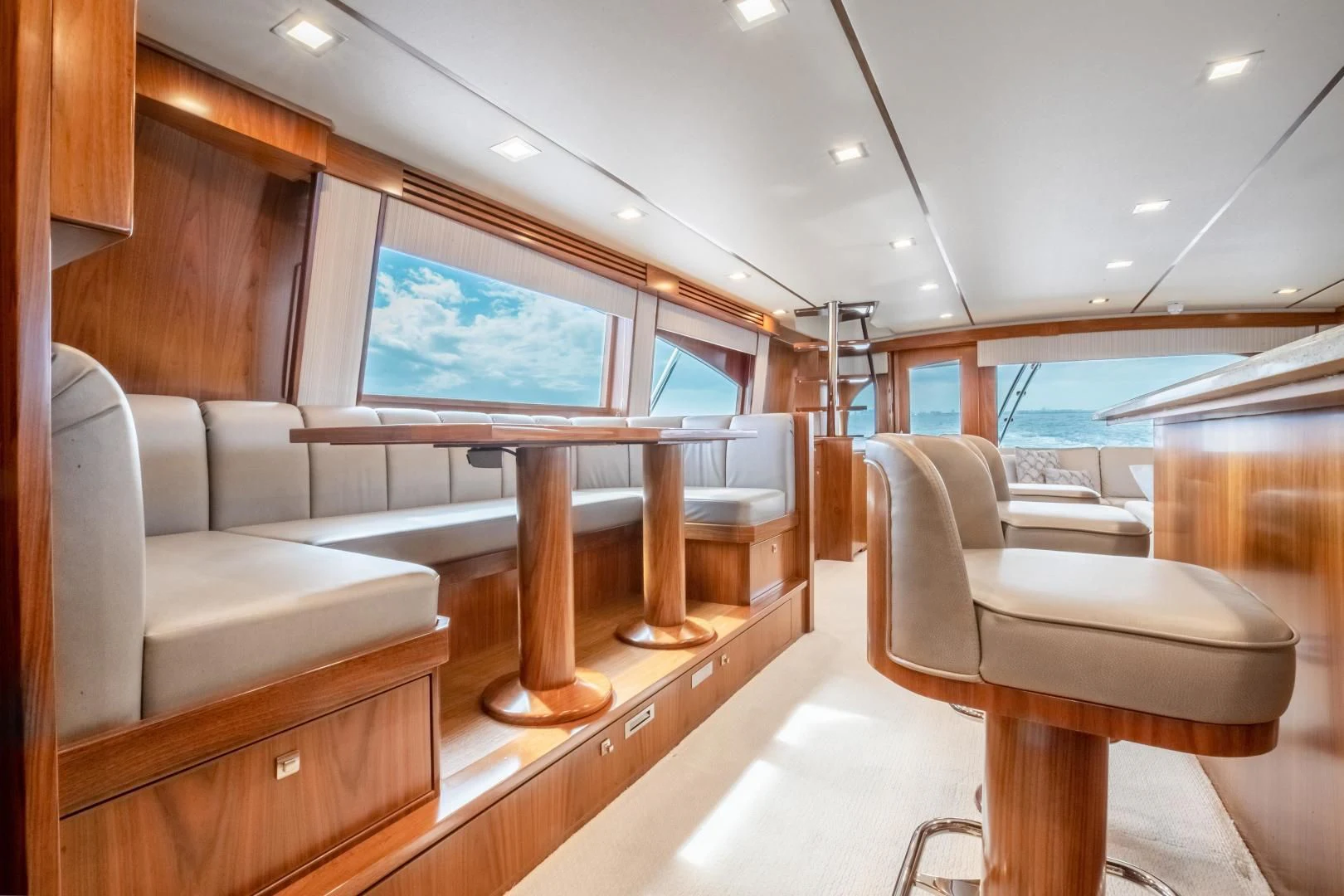 a room with a couch and a table aboard TEUSEAS Yacht for Sale
