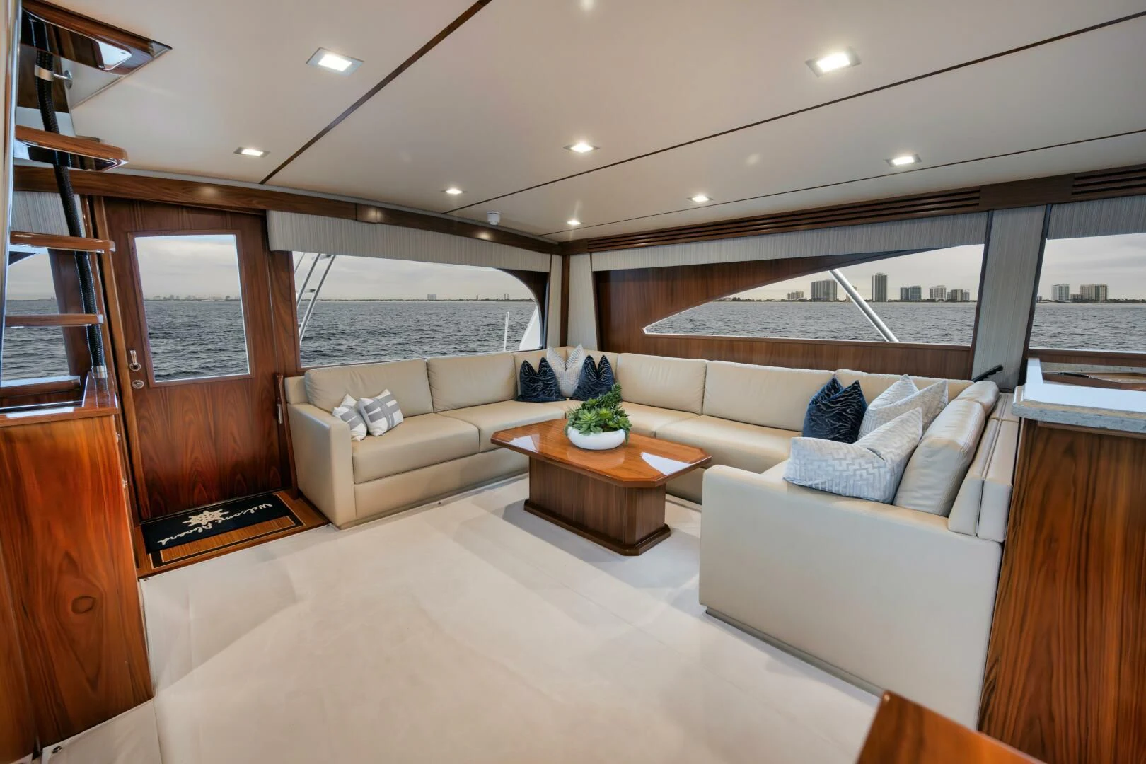 a living room with a couch and a table aboard TEUSEAS Yacht for Sale
