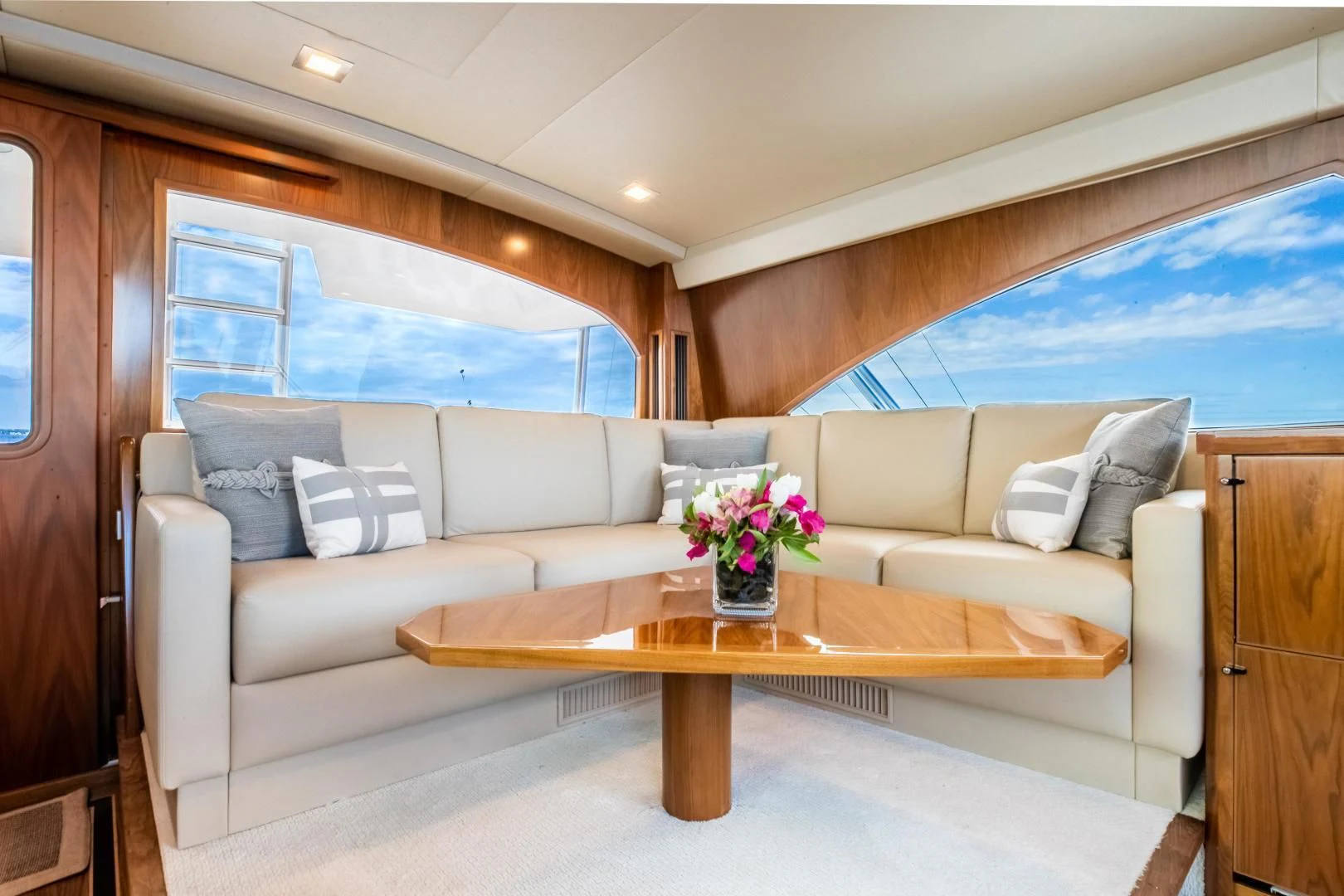 a living room with a couch and a table aboard TEUSEAS Yacht for Sale