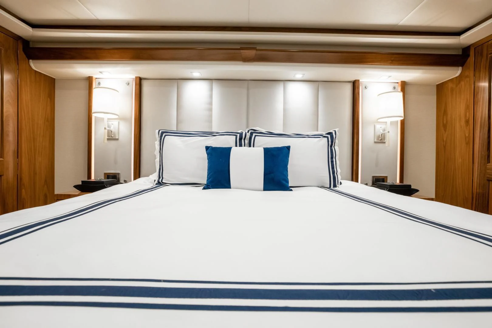 a bed with white sheets aboard TEUSEAS Yacht for Sale