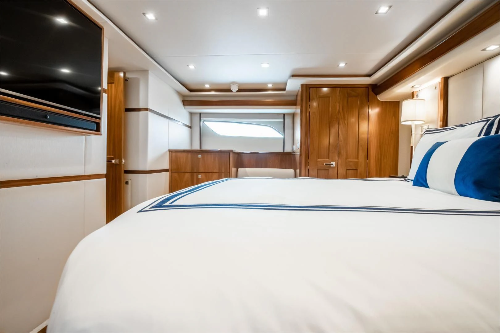 a room with a bed and a tv aboard TEUSEAS Yacht for Sale