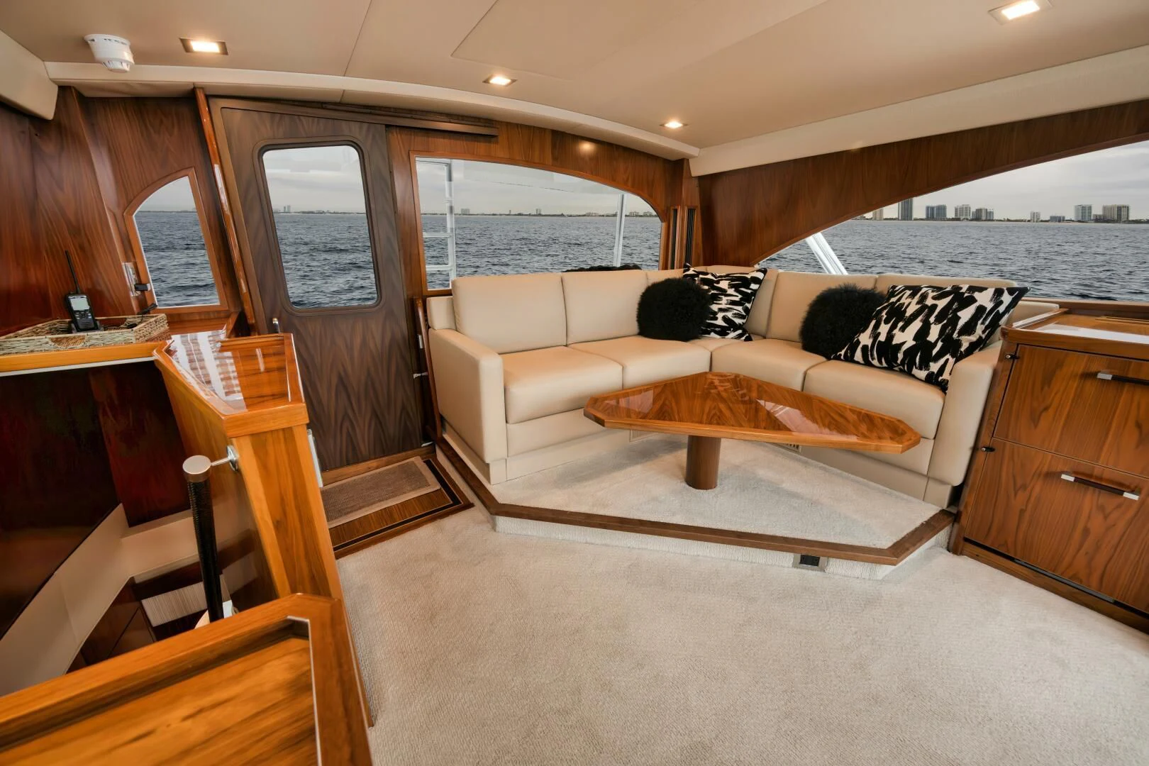 a living room with a couch and a table aboard TEUSEAS Yacht for Sale