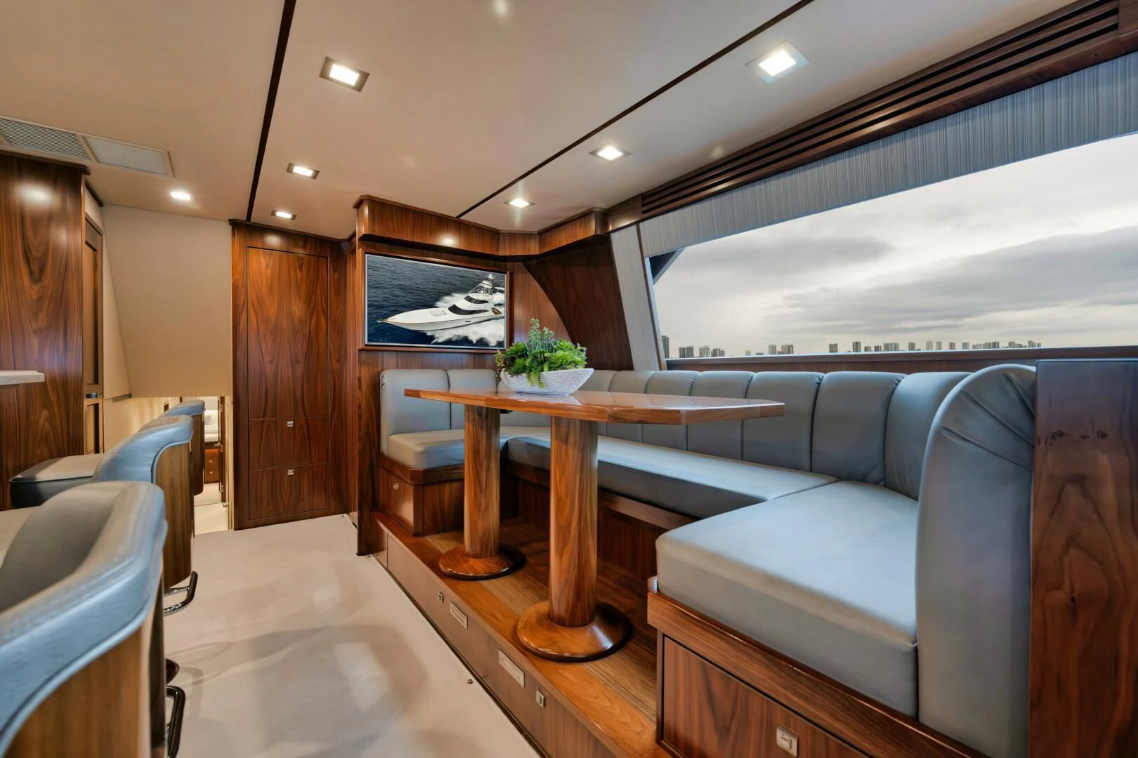 a living room with a couch and a table aboard TEUSEAS Yacht for Sale