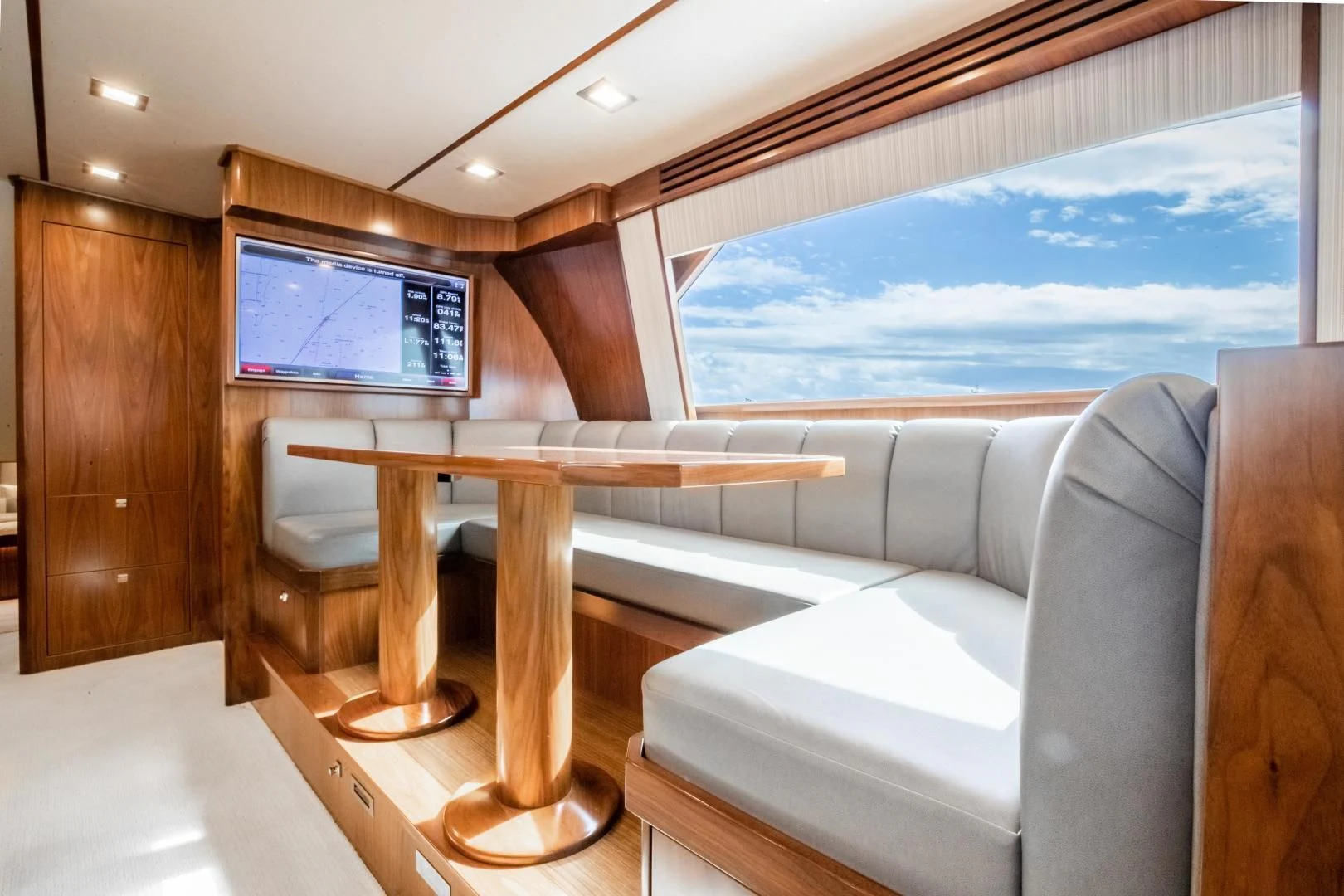 a room with a couch and a table aboard TEUSEAS Yacht for Sale