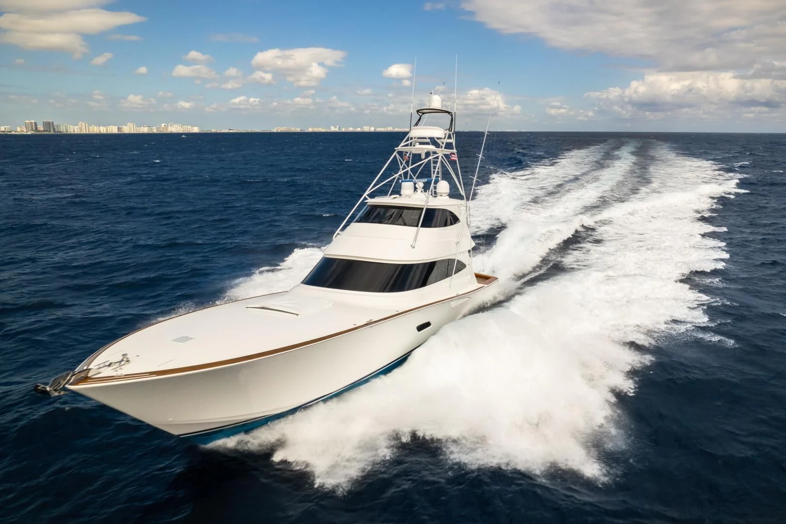 a white boat on the water aboard TEUSEAS Yacht for Sale