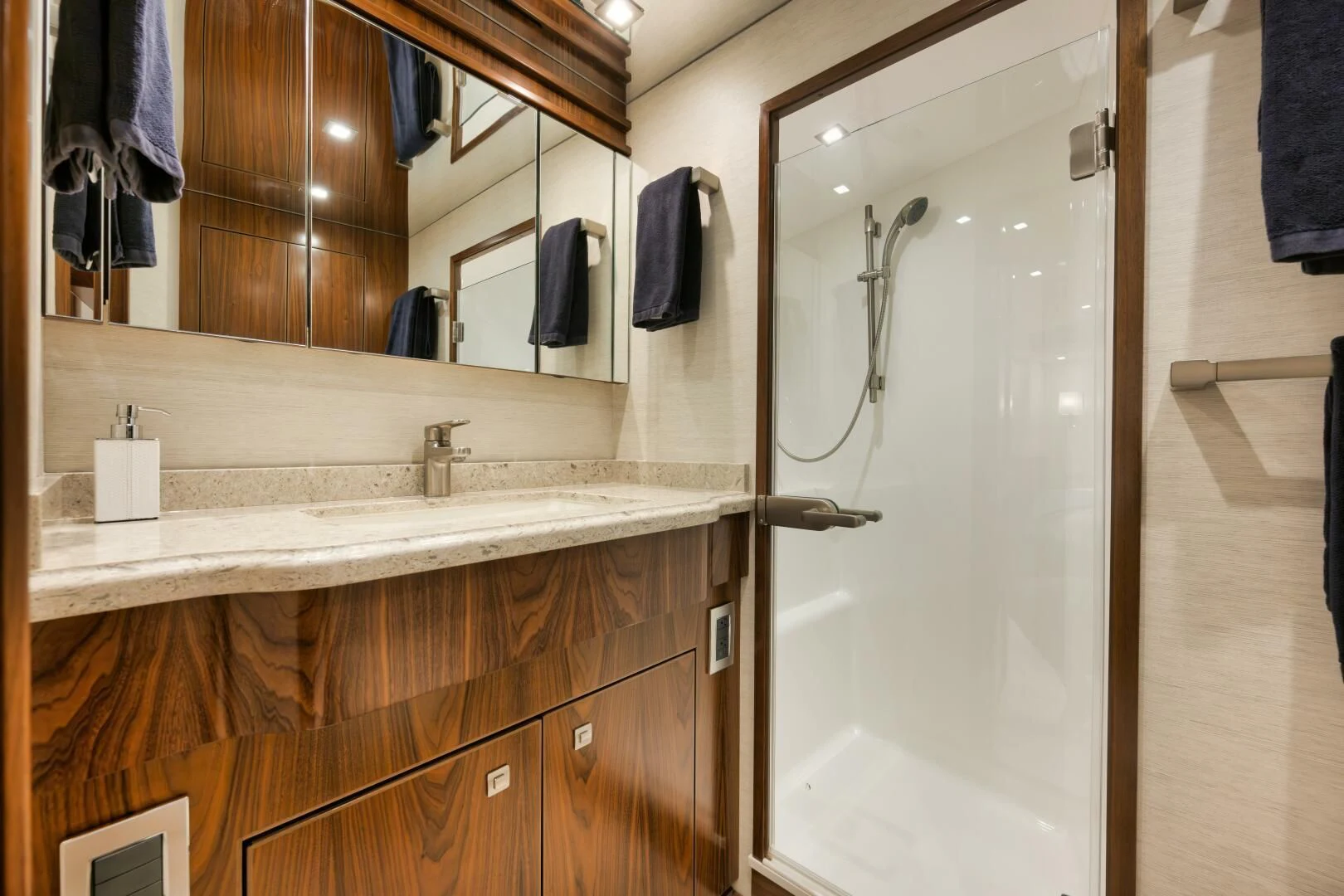 a bathroom with a glass shower aboard TEUSEAS Yacht for Sale