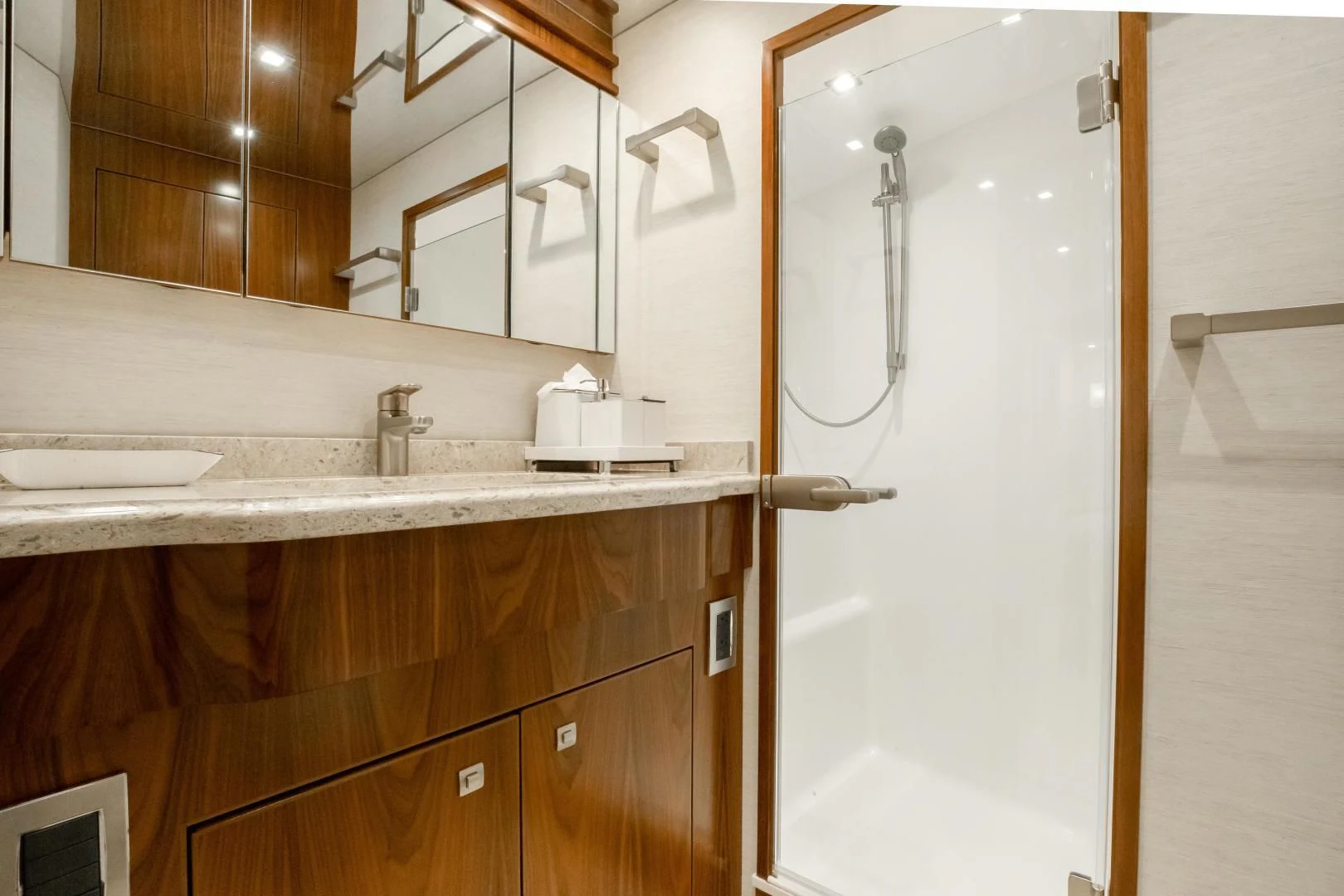 a bathroom with a sink and a mirror aboard TEUSEAS Yacht for Sale