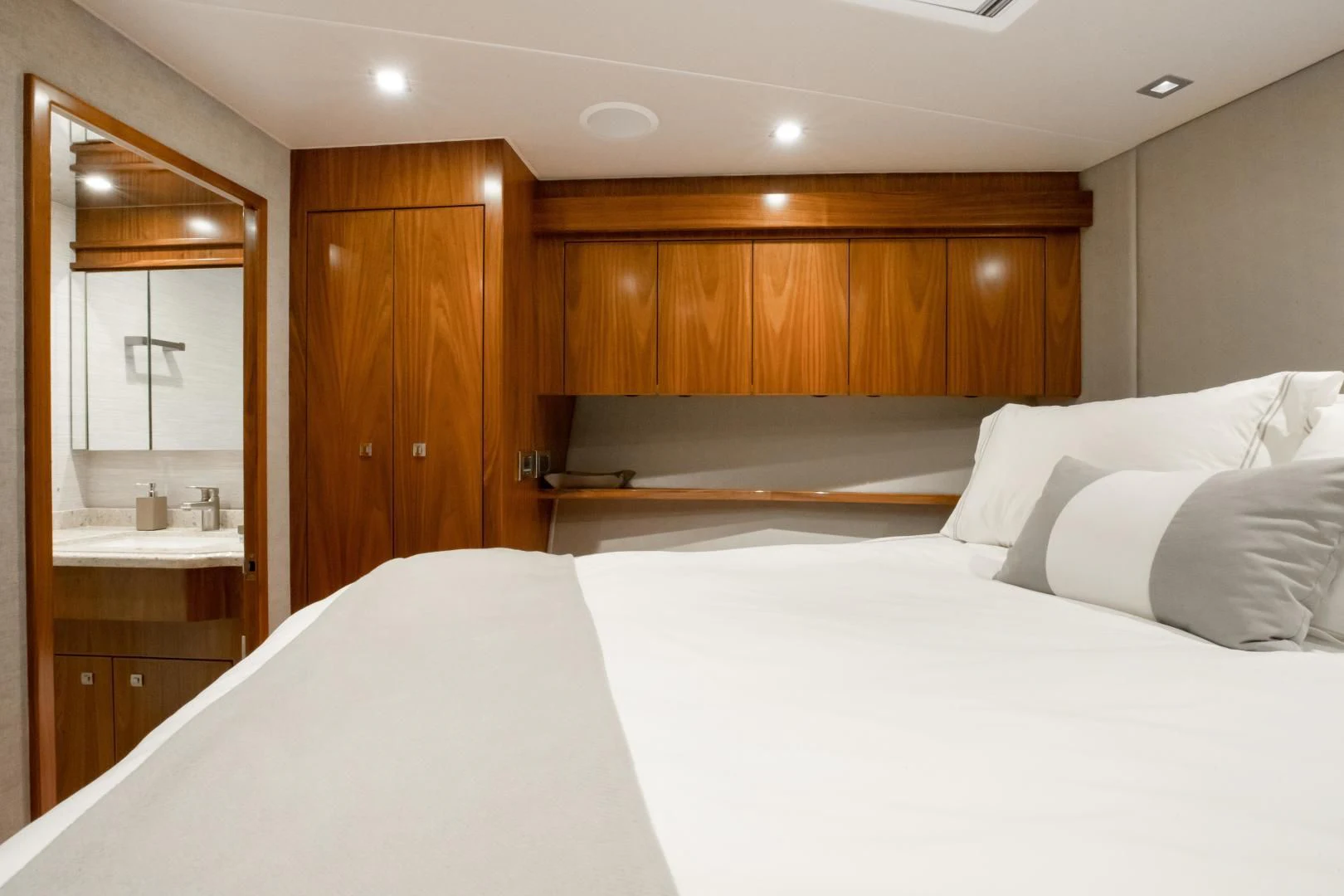 a room with a bed and a mirror aboard TEUSEAS Yacht for Sale