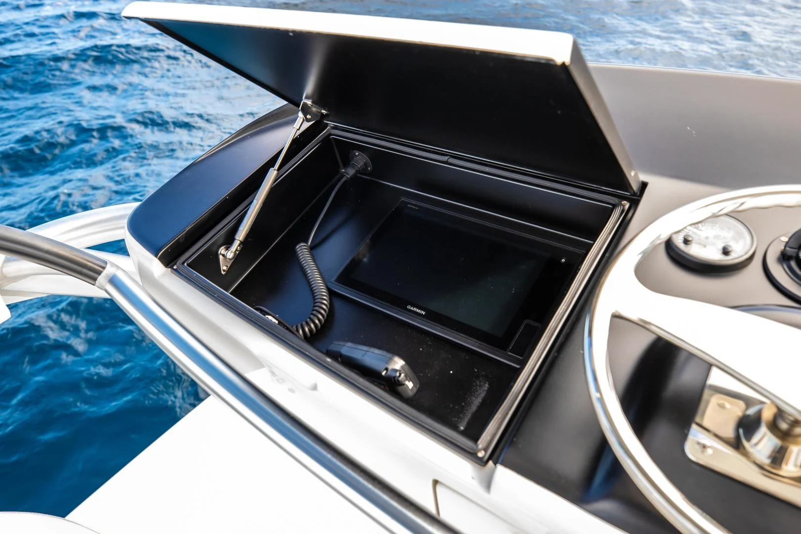 the steering wheel and dashboard of a car aboard TEUSEAS Yacht for Sale