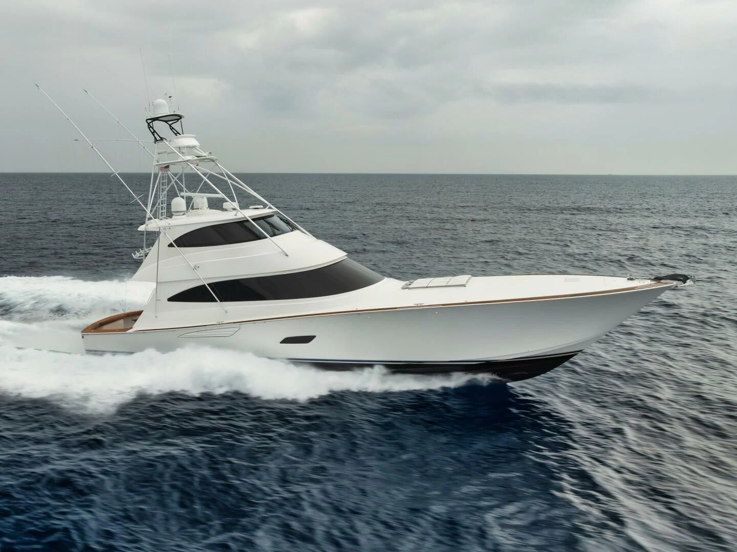 a white boat on the water aboard TEUSEAS Yacht for Sale