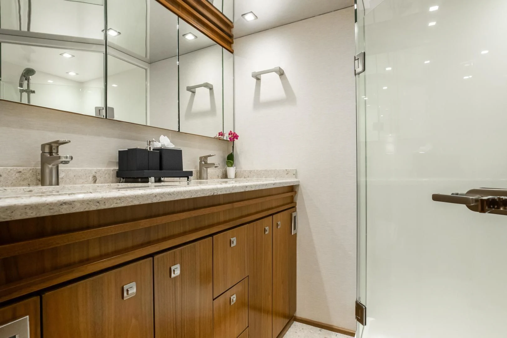 a bathroom with a sink and a mirror aboard TEUSEAS Yacht for Sale