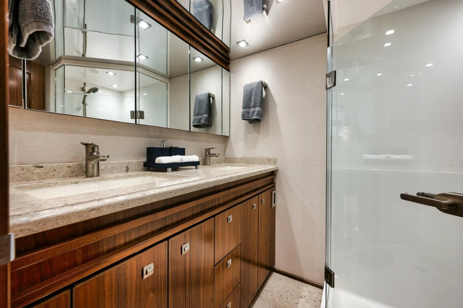 a bathroom with a sink and a mirror aboard TEUSEAS Yacht for Sale