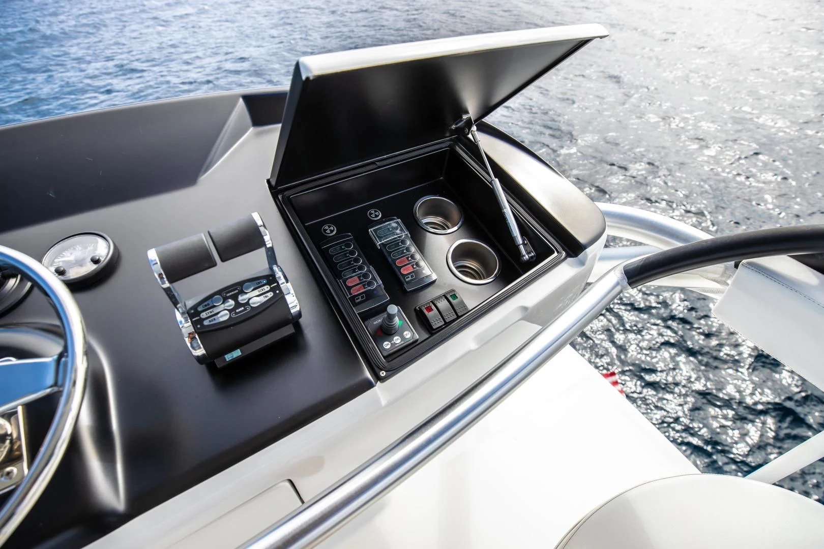 a steering wheel and dashboard of a car aboard TEUSEAS Yacht for Sale