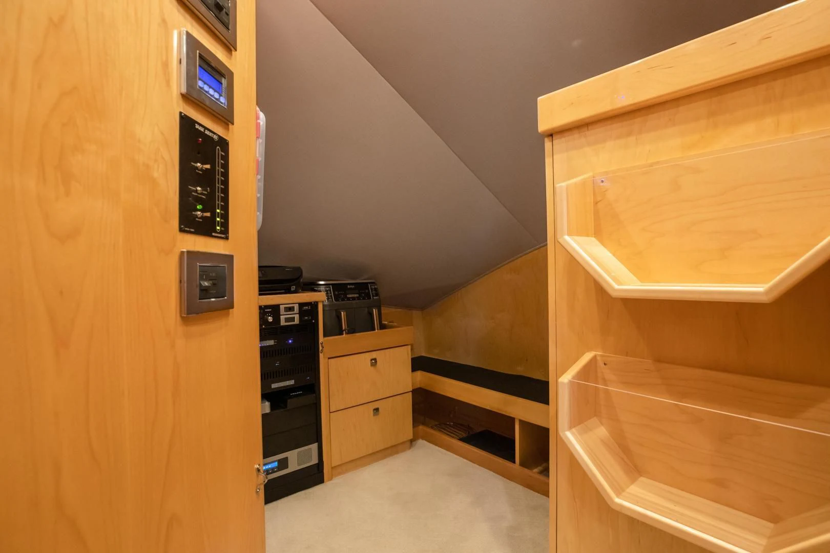 a room with a cabinet and a shelf with drawers aboard TEUSEAS Yacht for Sale