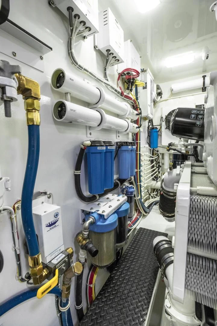 a white machine with blue and yellow wires aboard TEUSEAS Yacht for Sale