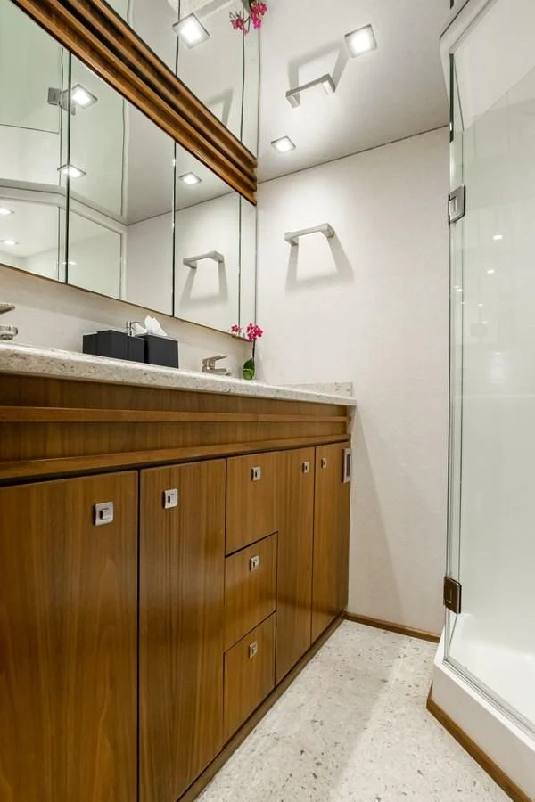 a bathroom with a sink and a mirror aboard TEUSEAS Yacht for Sale