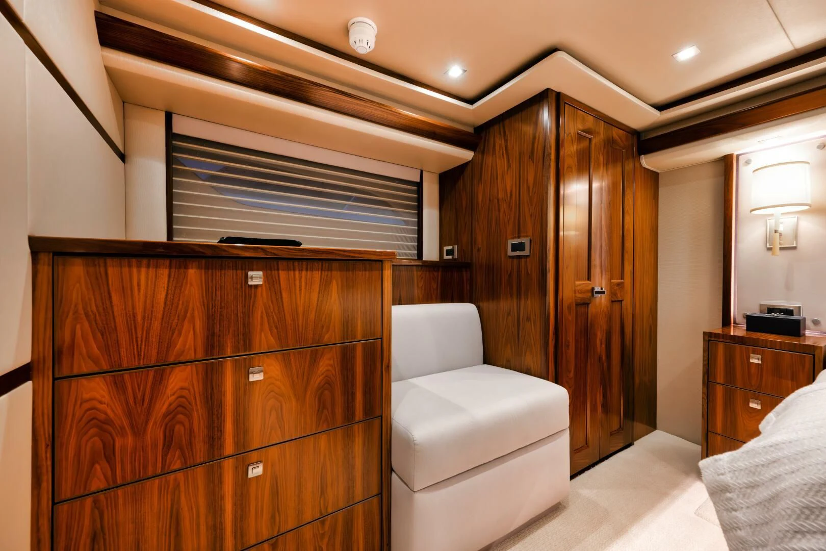 a room with a bed and a chair aboard TEUSEAS Yacht for Sale