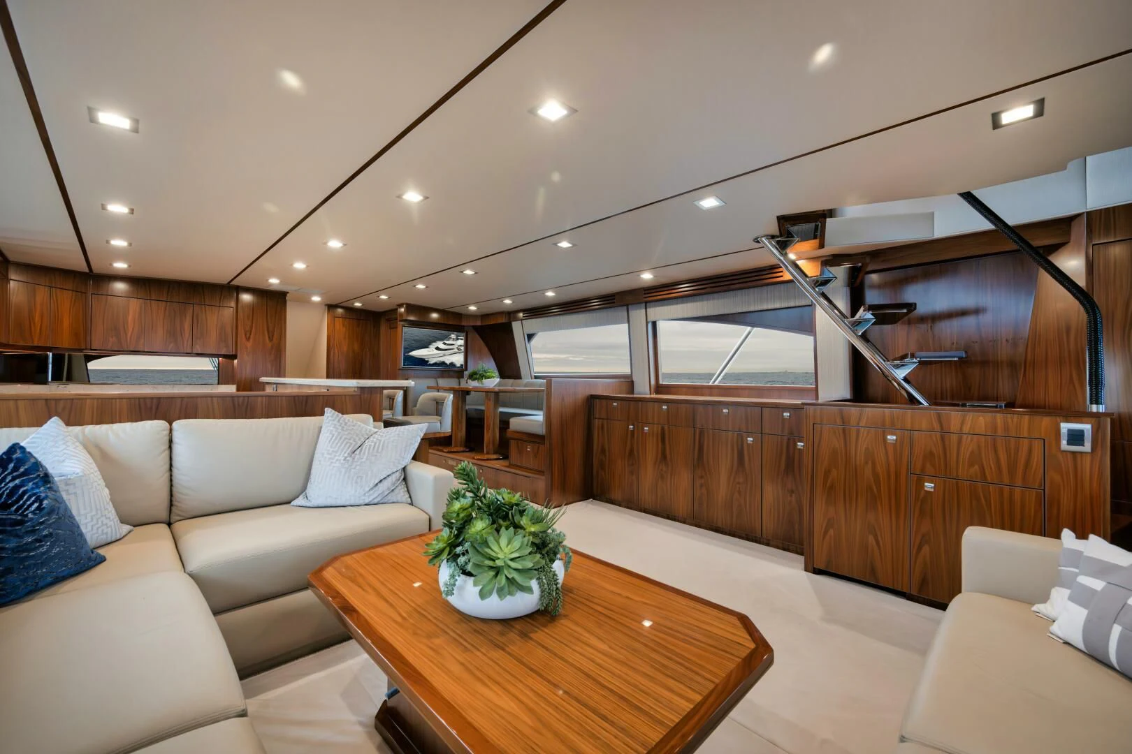 a living room with a wood wall aboard TEUSEAS Yacht for Sale