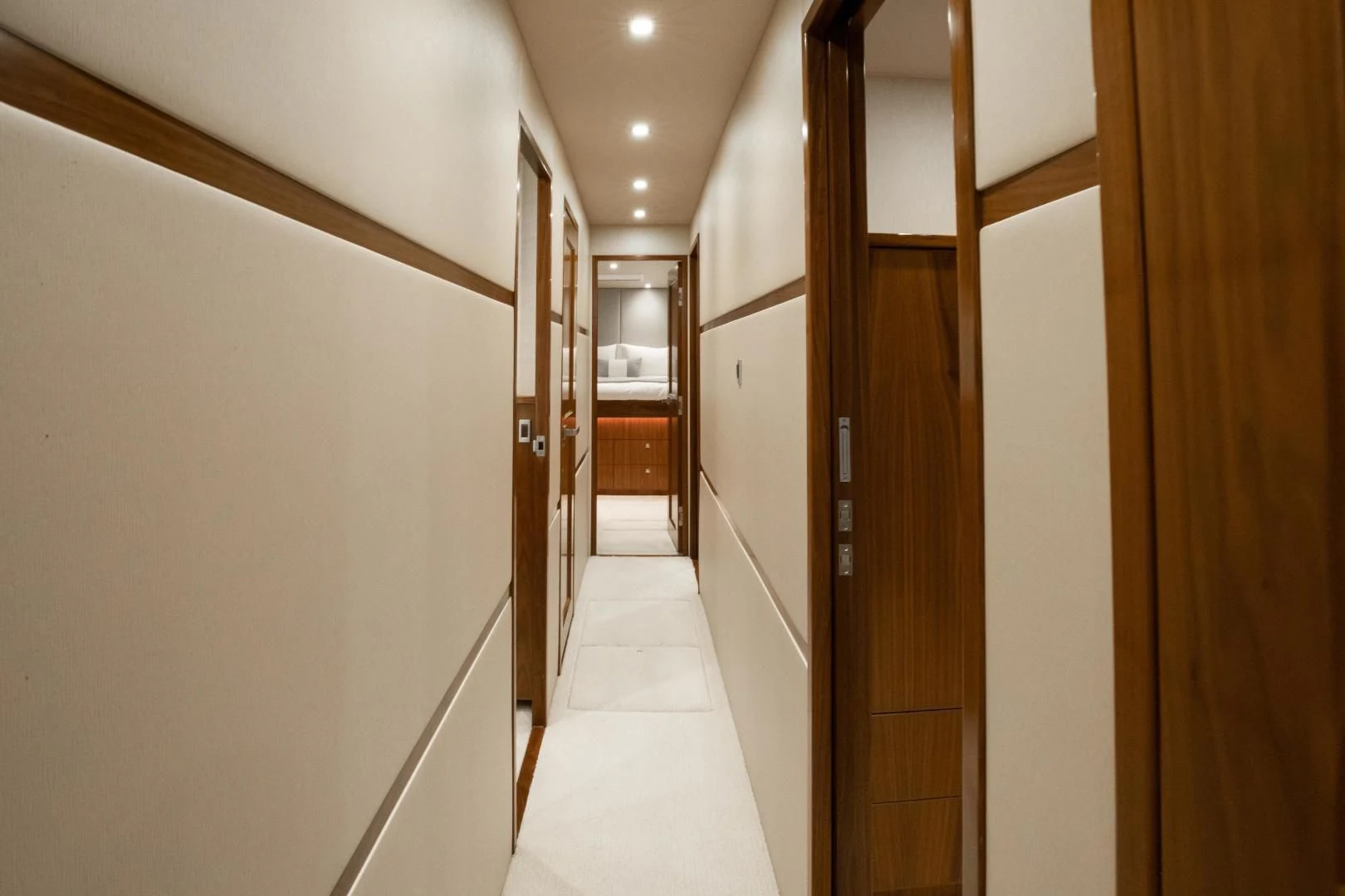 a hallway with doors aboard TEUSEAS Yacht for Sale