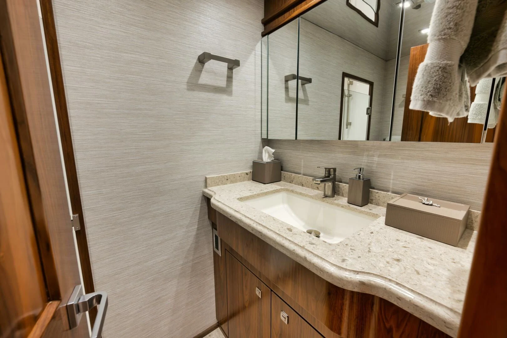 a bathroom with a sink and a mirror aboard TEUSEAS Yacht for Sale
