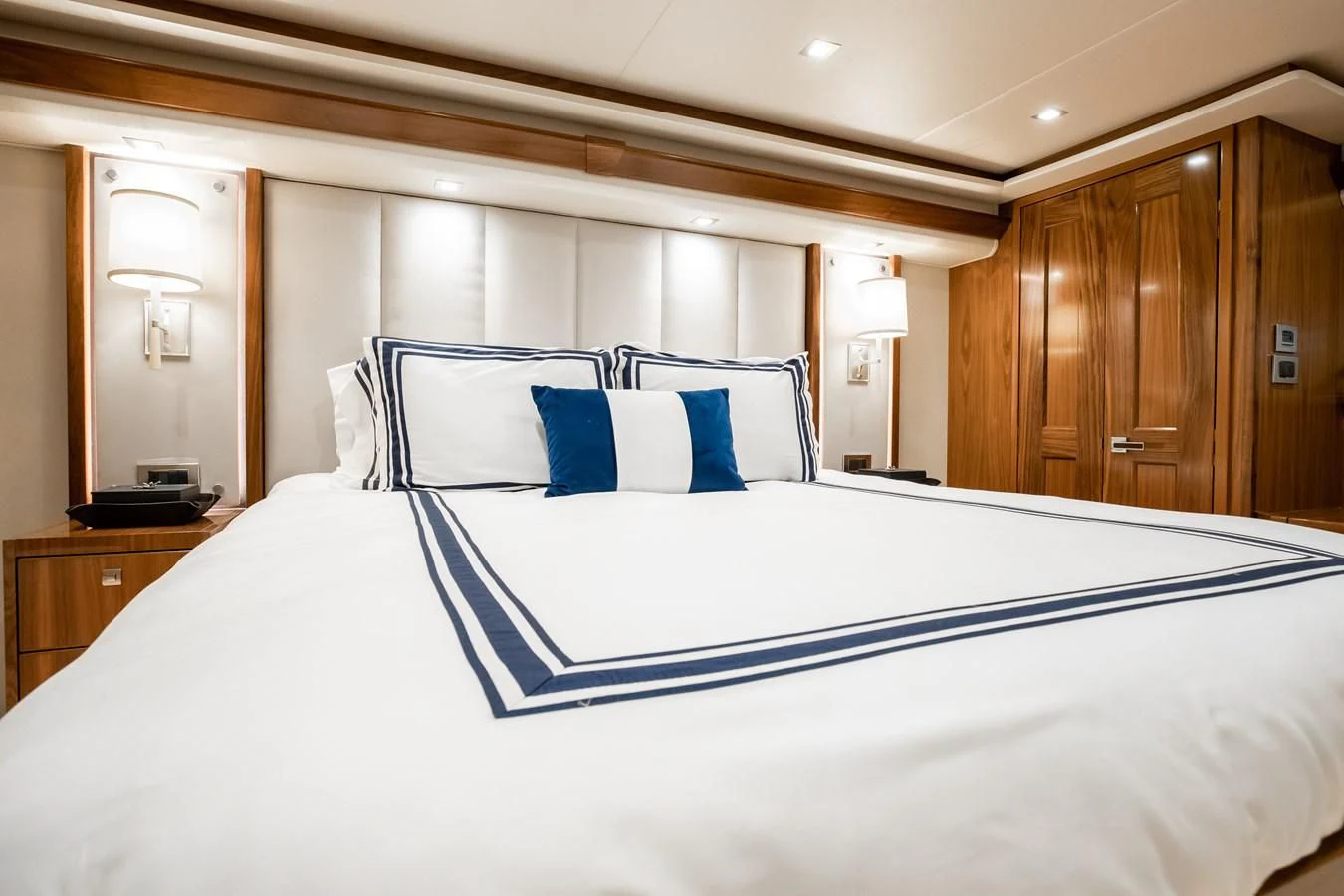 a bed with white sheets aboard TEUSEAS Yacht for Sale