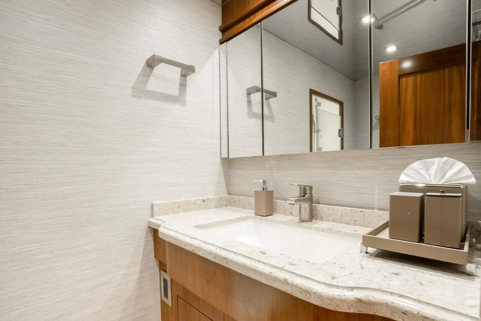 a bathroom with a mirror and a sink aboard TEUSEAS Yacht for Sale