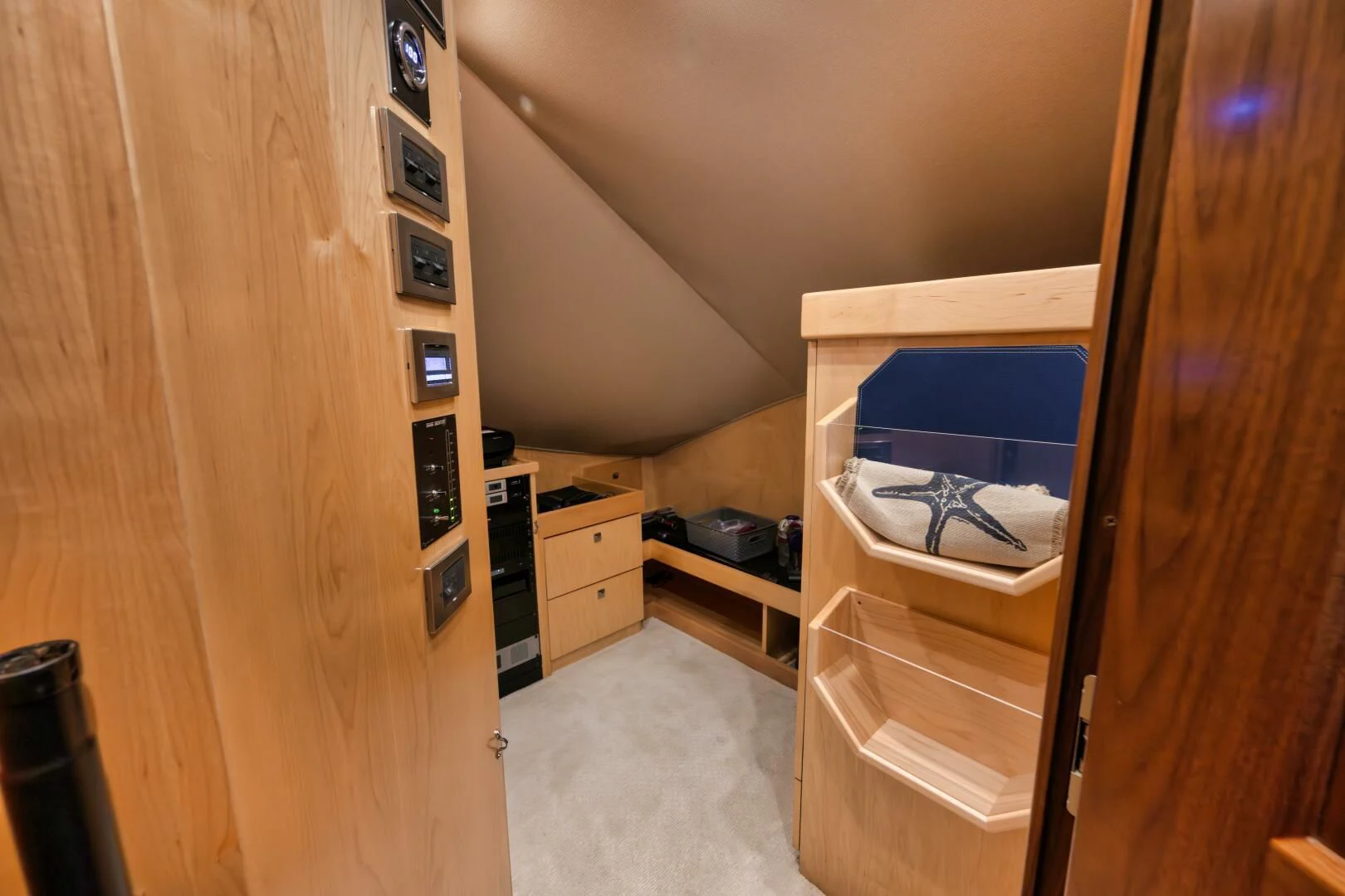 a room with a bunk bed and a shelf with drawers aboard TEUSEAS Yacht for Sale