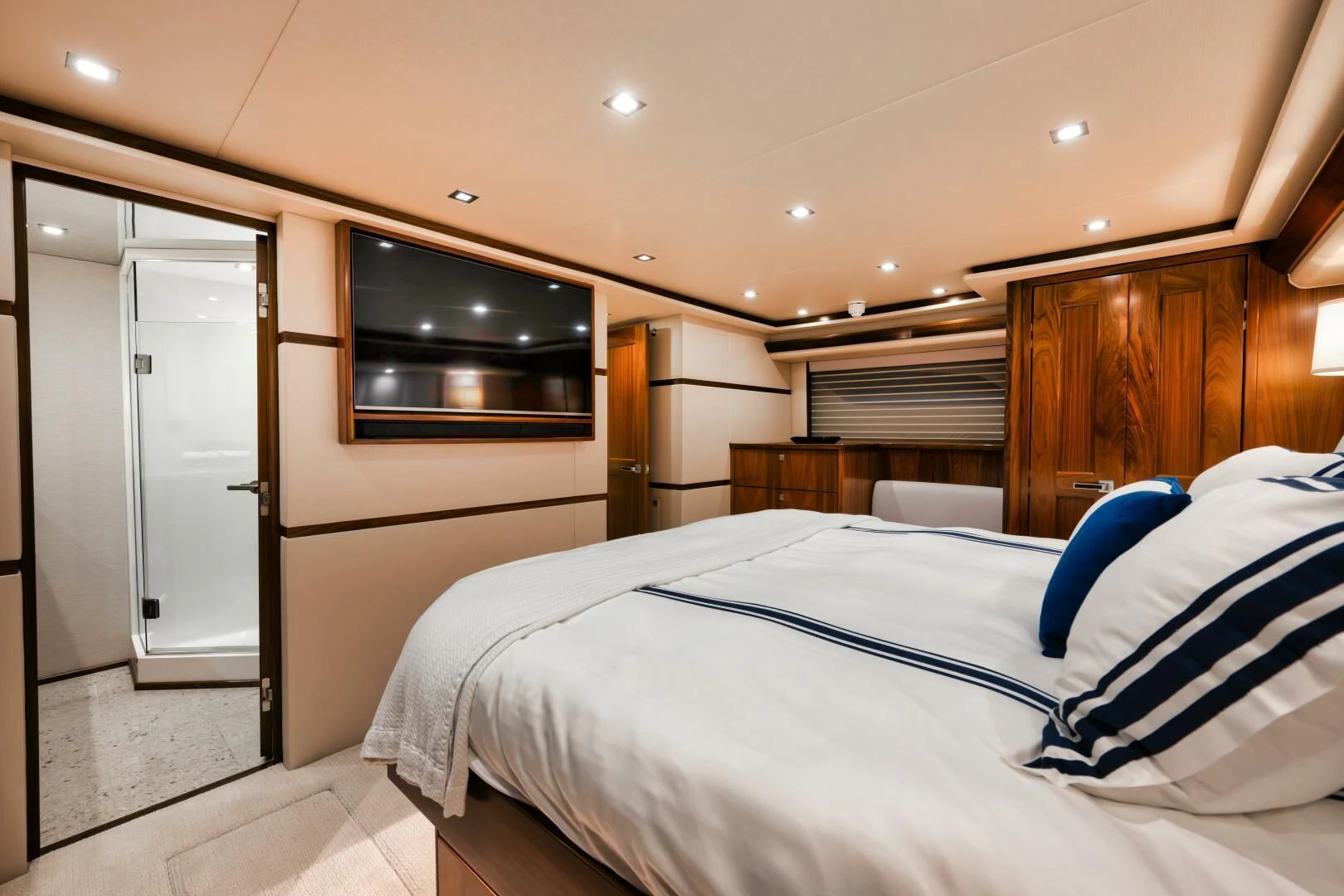 a room with a bed and a television aboard TEUSEAS Yacht for Sale
