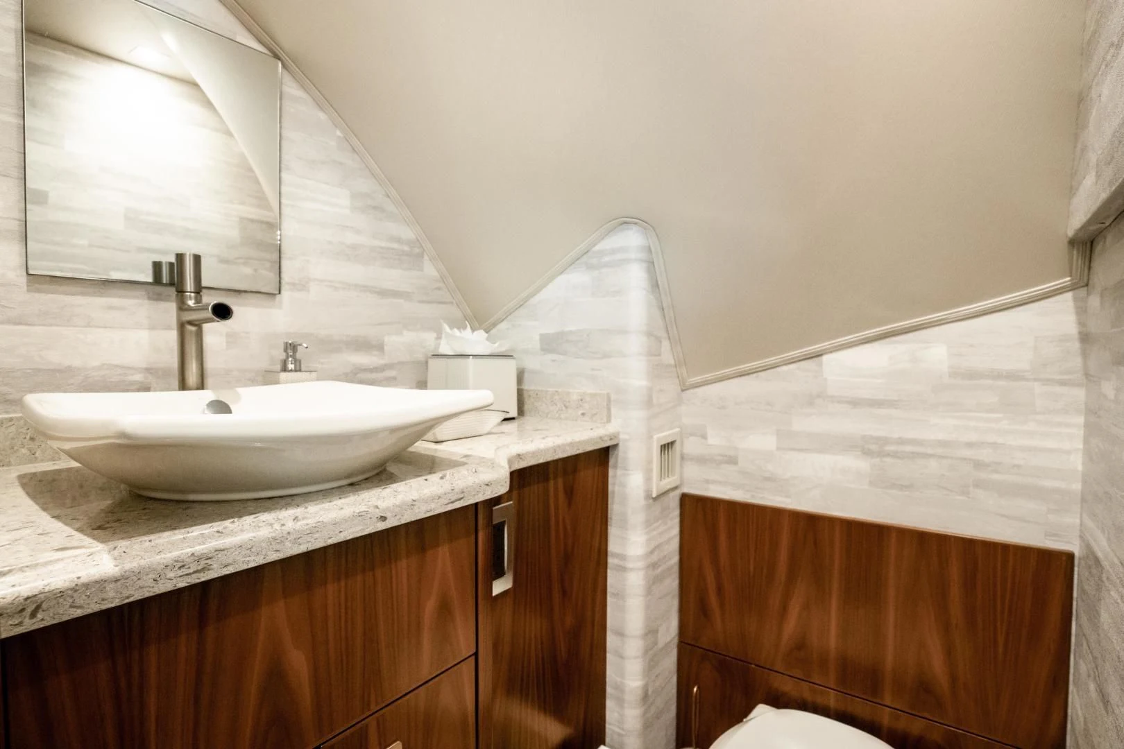 a bathroom with a sink and a mirror aboard TEUSEAS Yacht for Sale