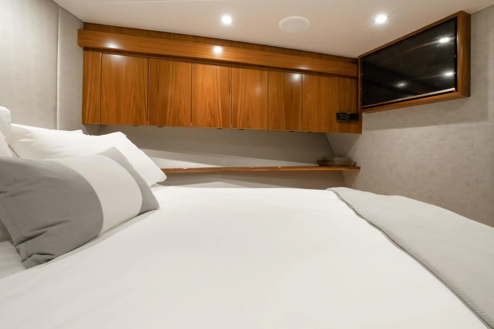 a bed with white sheets aboard TEUSEAS Yacht for Sale