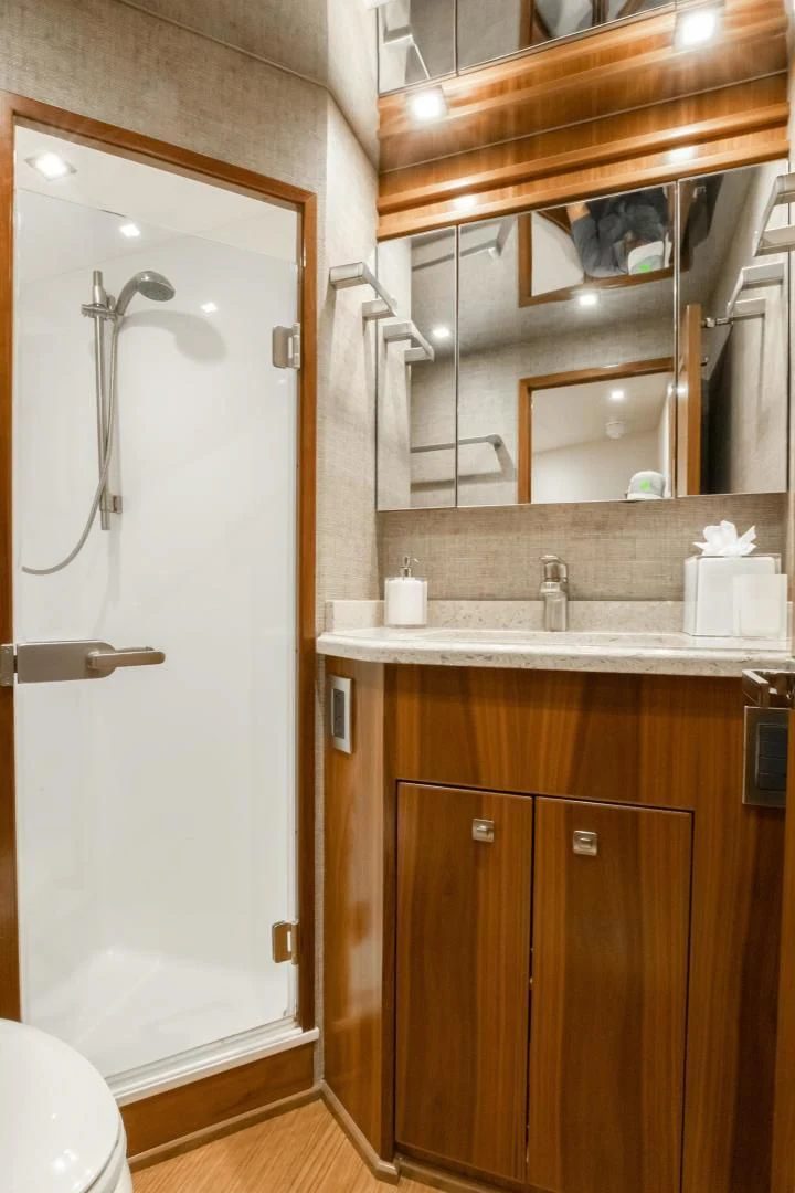 a bathroom with a sink and a mirror aboard TEUSEAS Yacht for Sale