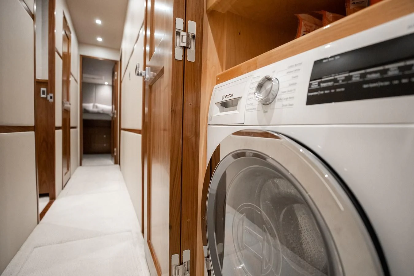 a washing machine in a room aboard TEUSEAS Yacht for Sale