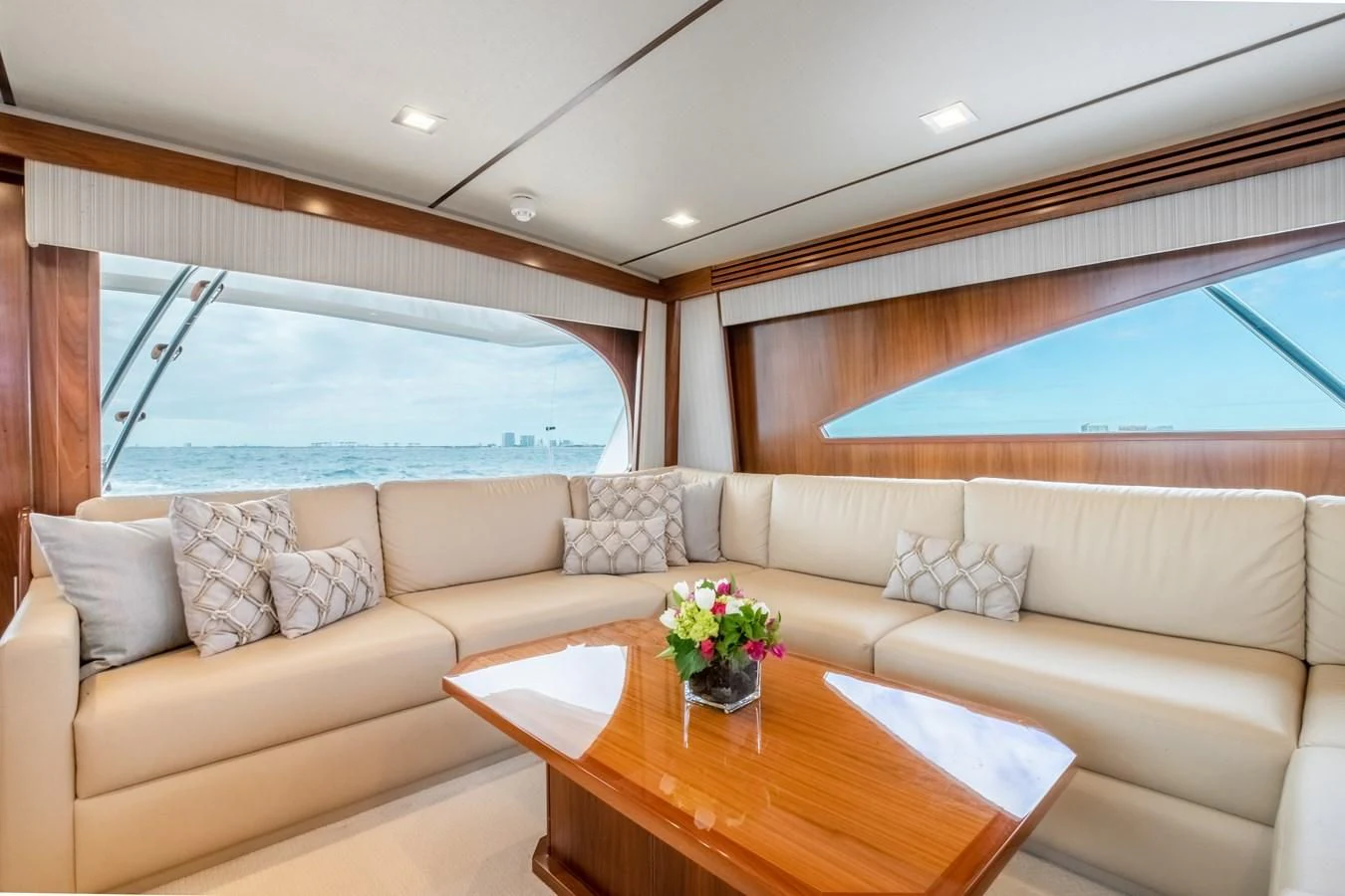 a living room with a couch and a table aboard TEUSEAS Yacht for Sale