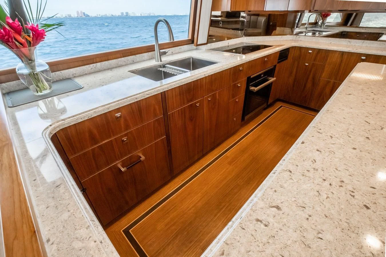 a kitchen with a large island aboard TEUSEAS Yacht for Sale