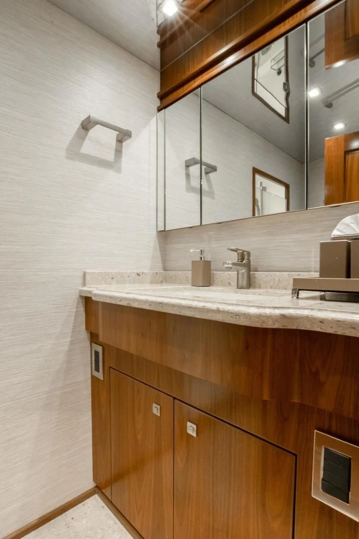 a bathroom with a sink and a mirror aboard TEUSEAS Yacht for Sale