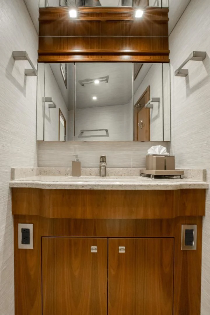a bathroom with a sink and cabinets aboard TEUSEAS Yacht for Sale