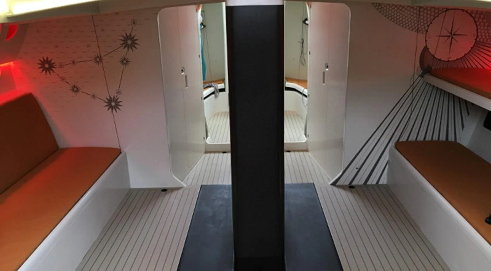 a room with a red couch and a red clock aboard HIGH SPIRIT Yacht for Sale
